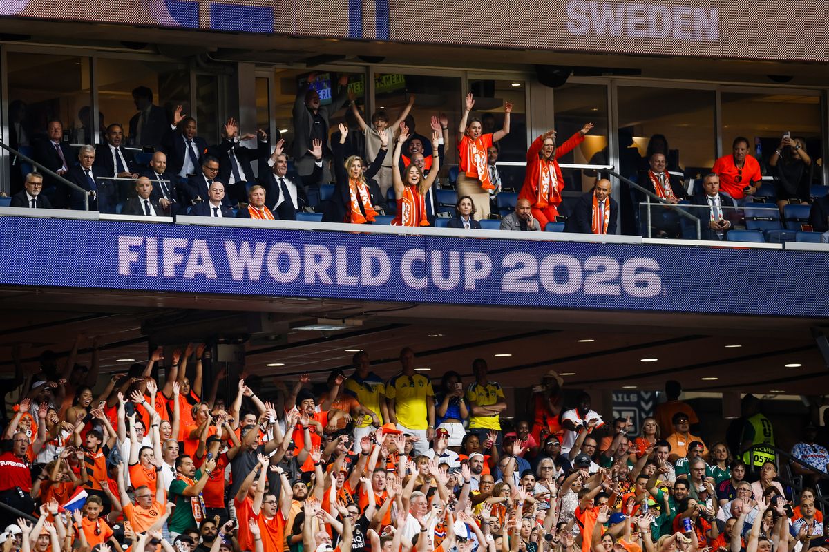 Dressed in the Netherlands' signature orange, the Dutch royal family celebrates from the stands as Oranje cruises to victory.