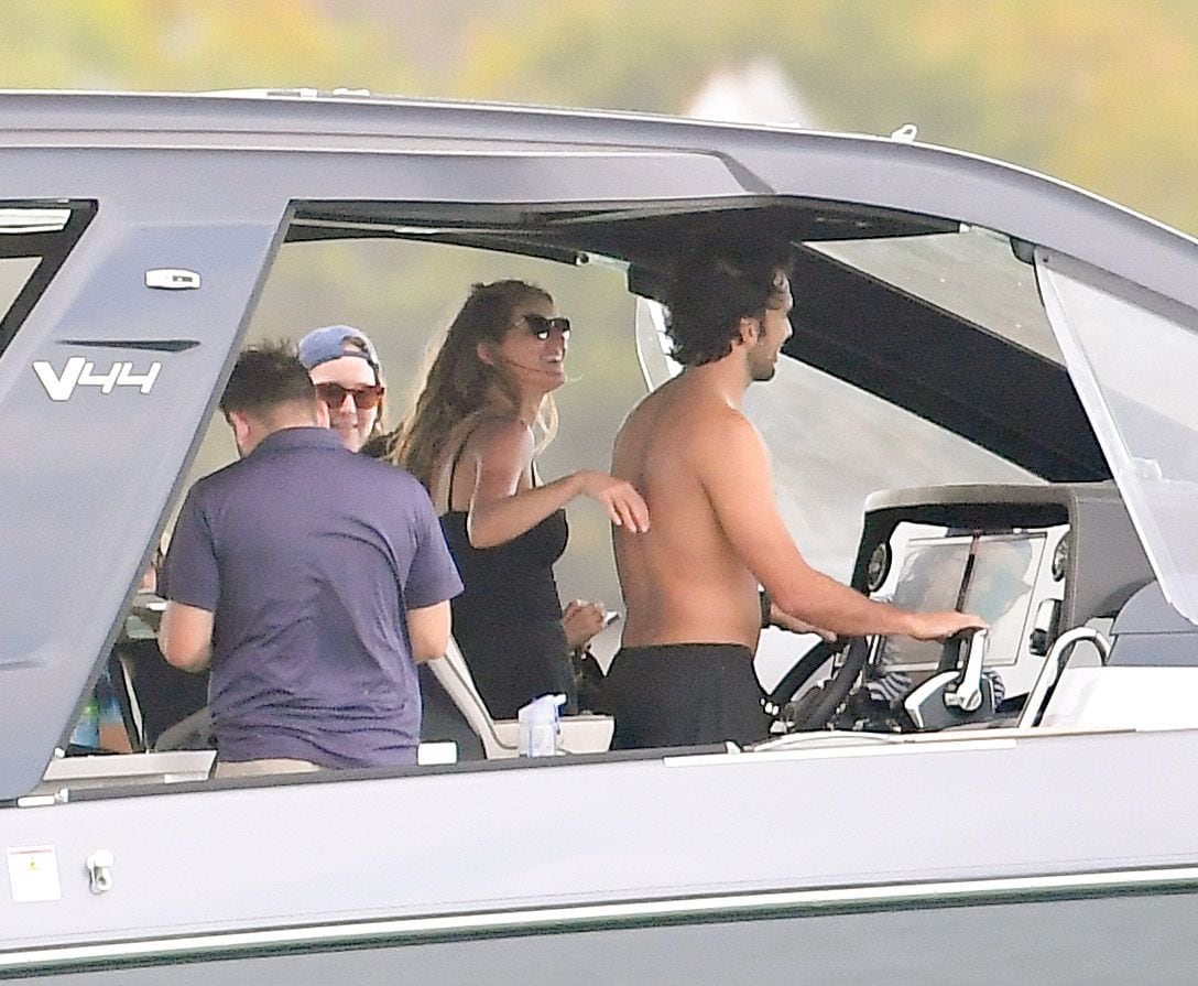Gisele Bundchen and Joaquim Valente pack on the PDA during a boat ride with friends in Miami