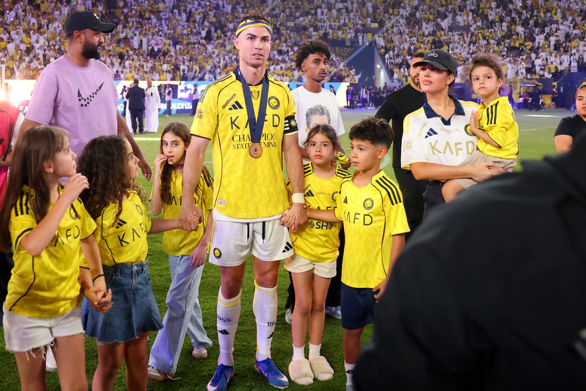 Cristiano Ronaldo poses with his family after winning the Saudi Pro League title at the end of the football match against Damac at the Al-Awwal Park Stadium in Riyadh on May 21, 2026.