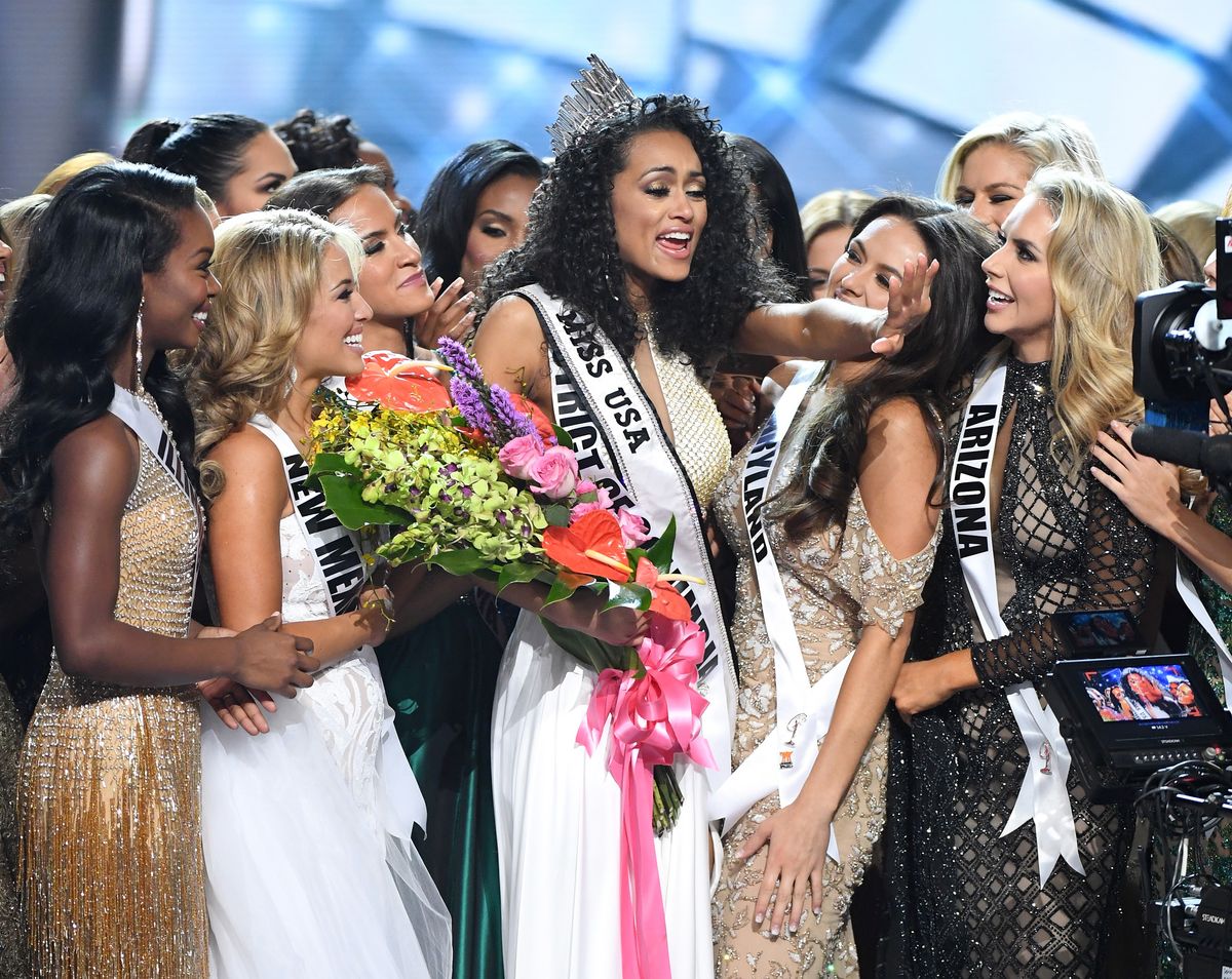 Miss District of Columbia USA 2017 Kara McCullough (C) is surrounded by fellow contestants after she was crowned Miss USA 2017 during the 2017 Miss USA pageant 