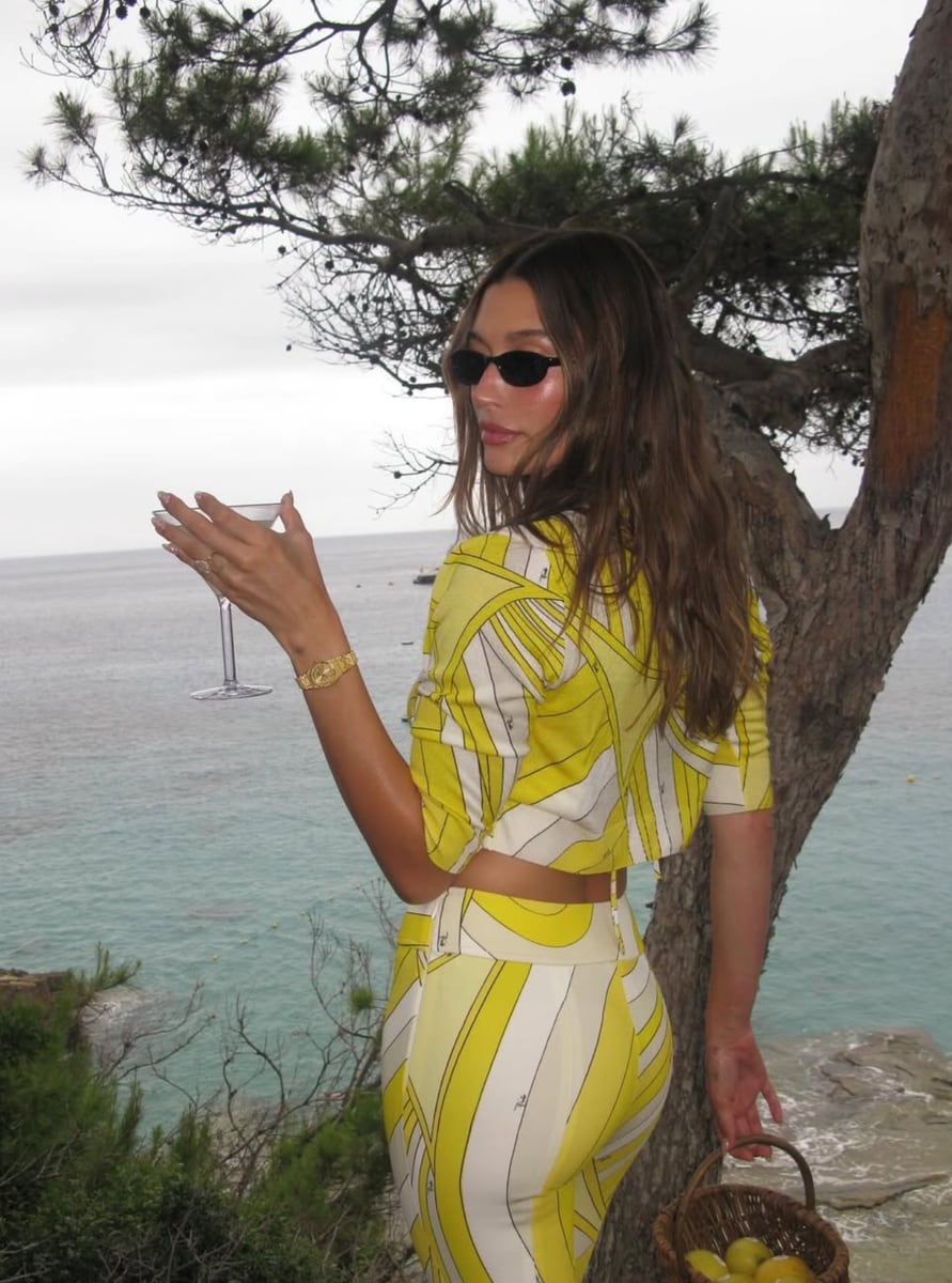 Hailey recently styled a yellow-and-white version with a cropped jacket and string bikini underneath. 