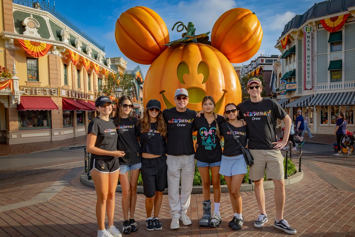 Matt Damon and his family in front of the giant Mickey Mouse pumpkin at Disneyland