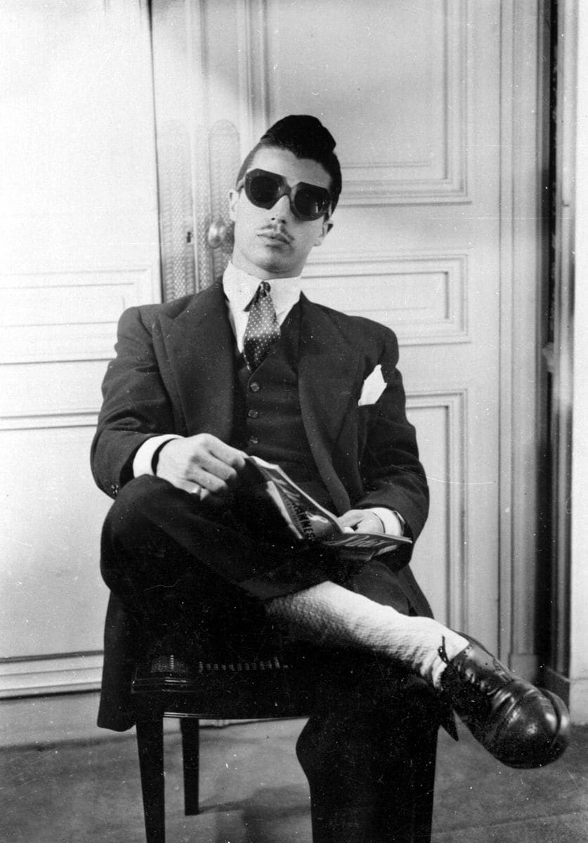 A man with a thin moustache and a quiff hairdo wearing a zoot style outfit in Paris, 1944. (Photo by Albert Harlingue/Roger Viollet via Getty Images)