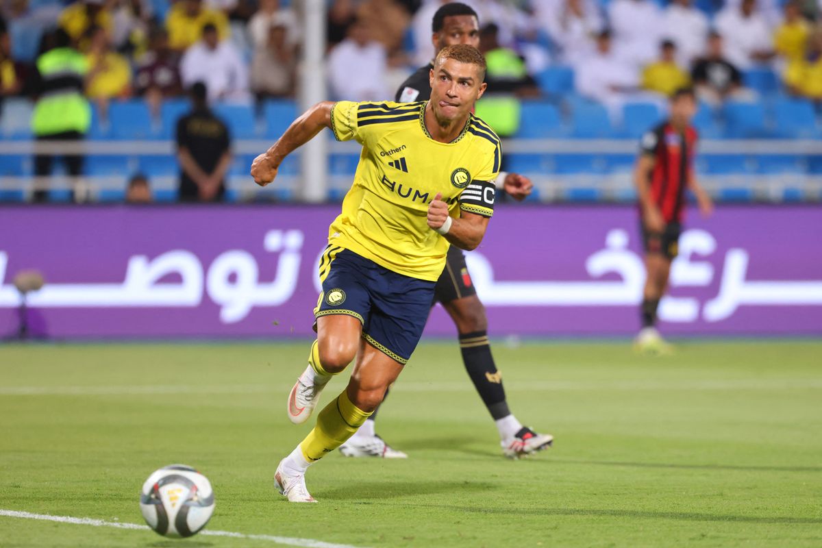 Nassr's Portuguese forward #07 Cristiano Ronaldo runs with the ball during the Saudi Pro League football match between Al-Nassr and Al-Riyadh