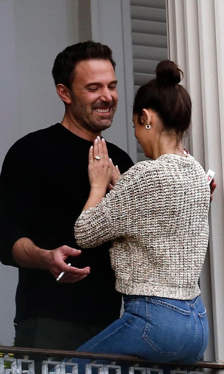 Ben Affleck and Ana de Armas on a balcony.