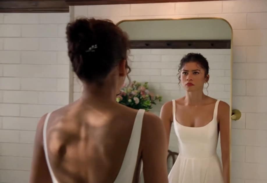 In the first teaser, Zendaya, 29, stuns in a backless, white wedding dress featuring a fitted bodice and a pleated, full skirt.