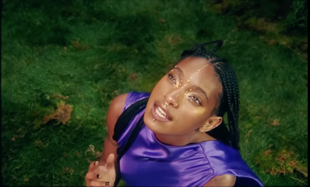 WILLOW channeled ethereal elegance in a flowing purple gown for her latest visual project.