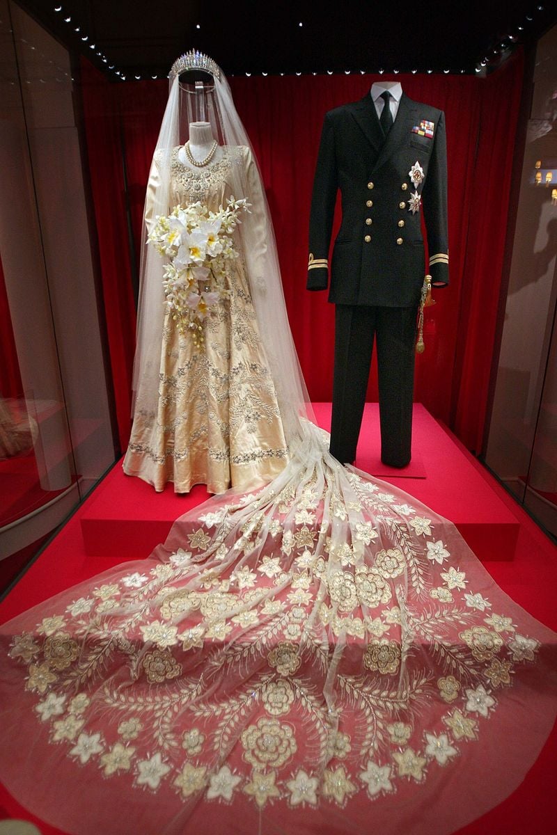 Princess Elizabeth's wedding dress, designed by Norman Hartnell, and the Duke of Edinburgh's Royal Naval uniform 