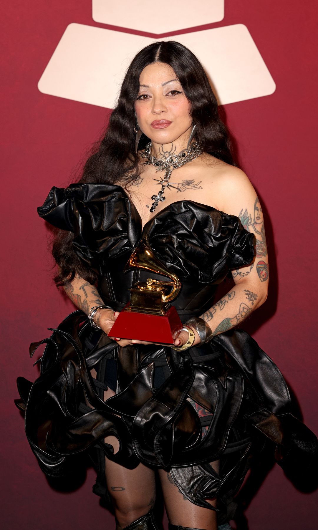 Mon Laferte poses with the award for Best Alternative Music Album for the album "Autopoiética" at the Premiere Ceremony during the 25th Latin GRAMMY Awards at Miami Beach Convention Center on November 14, 2024 in Miami, Florida. (Photo by Alexander Tamargo/Getty Images for The Latin Recording Academy)