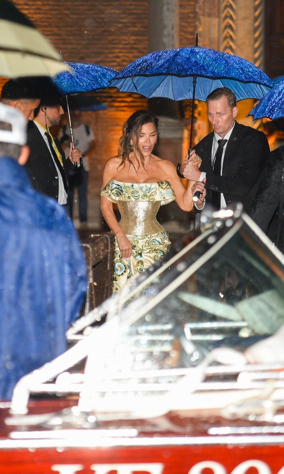A wet bride is a lucky bride! Jeff Bezos and bride, Lauren Sánchez, leave their wedding party under a huge thunderstorm in Venice
