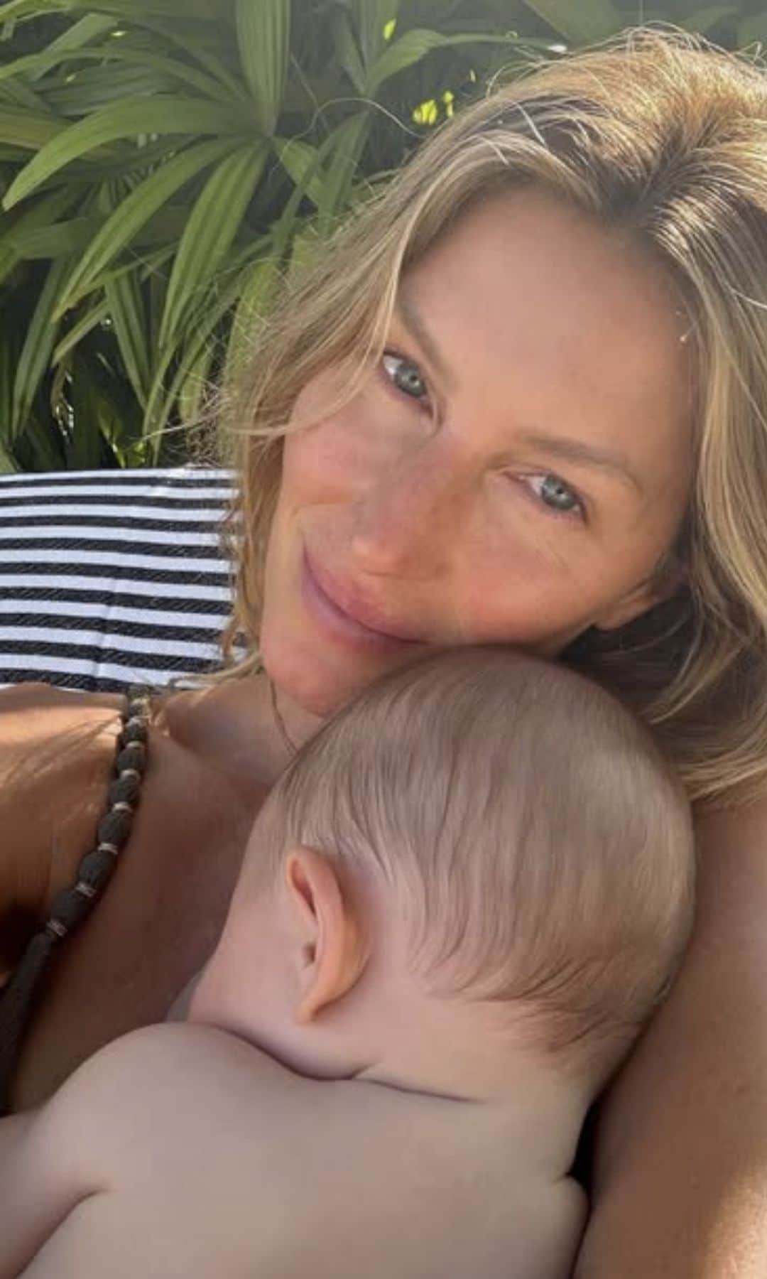 She also shared a photo with her baby, showing him nestled against her neck