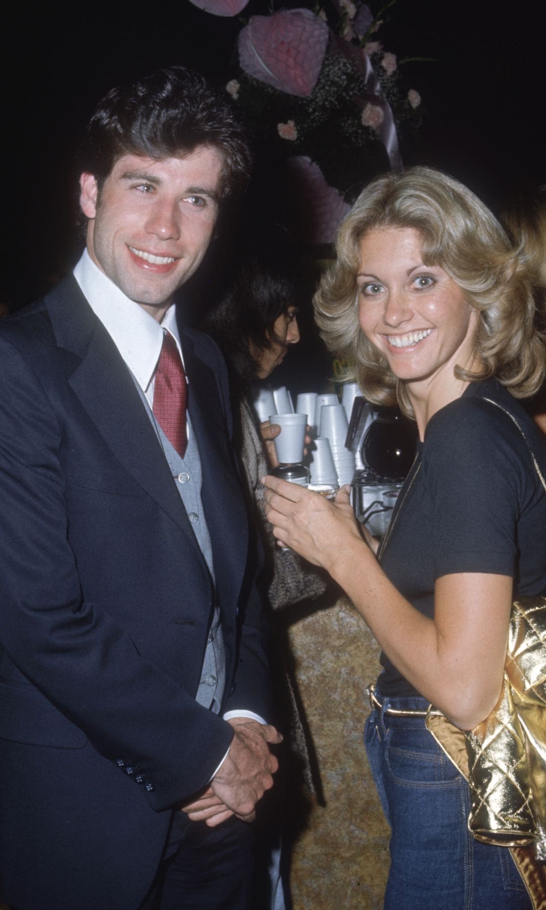 John Travolta and Olivia Newton-John in 1977, celebrating their work in "Grease"