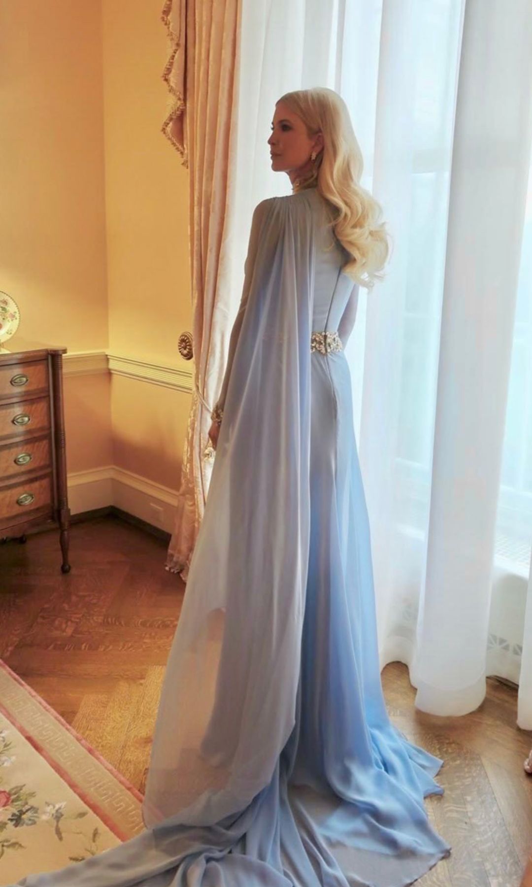 A closer look at Ivanka Trump’s flowing cape and silver embellishments, a nod to classic old-Hollywood glamour.