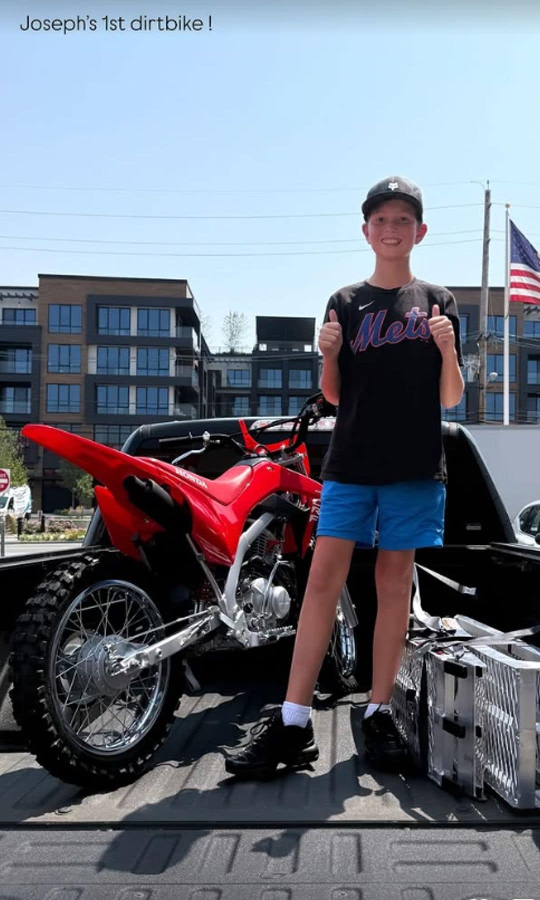 Joseph looked thrilled as he posed next to his dirt bike