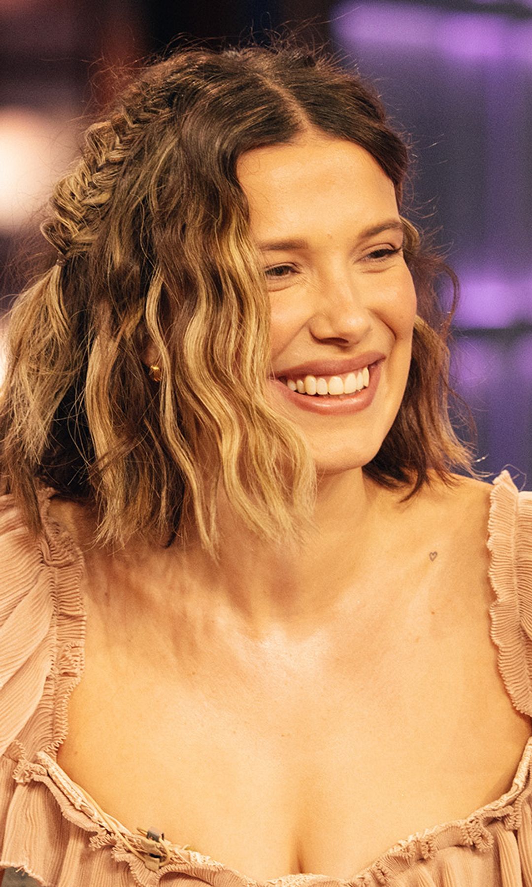 Millie Bobby Brown slips into a daring sheer nude corset dress with romantic lace embroidery