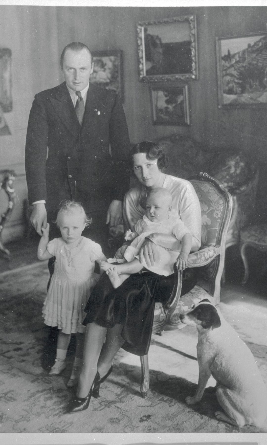 Prince and Princess Olav of Norway are seen here in the drawing room of their home at Skaugum with their children, Princess Ragnhild and princess Astrid