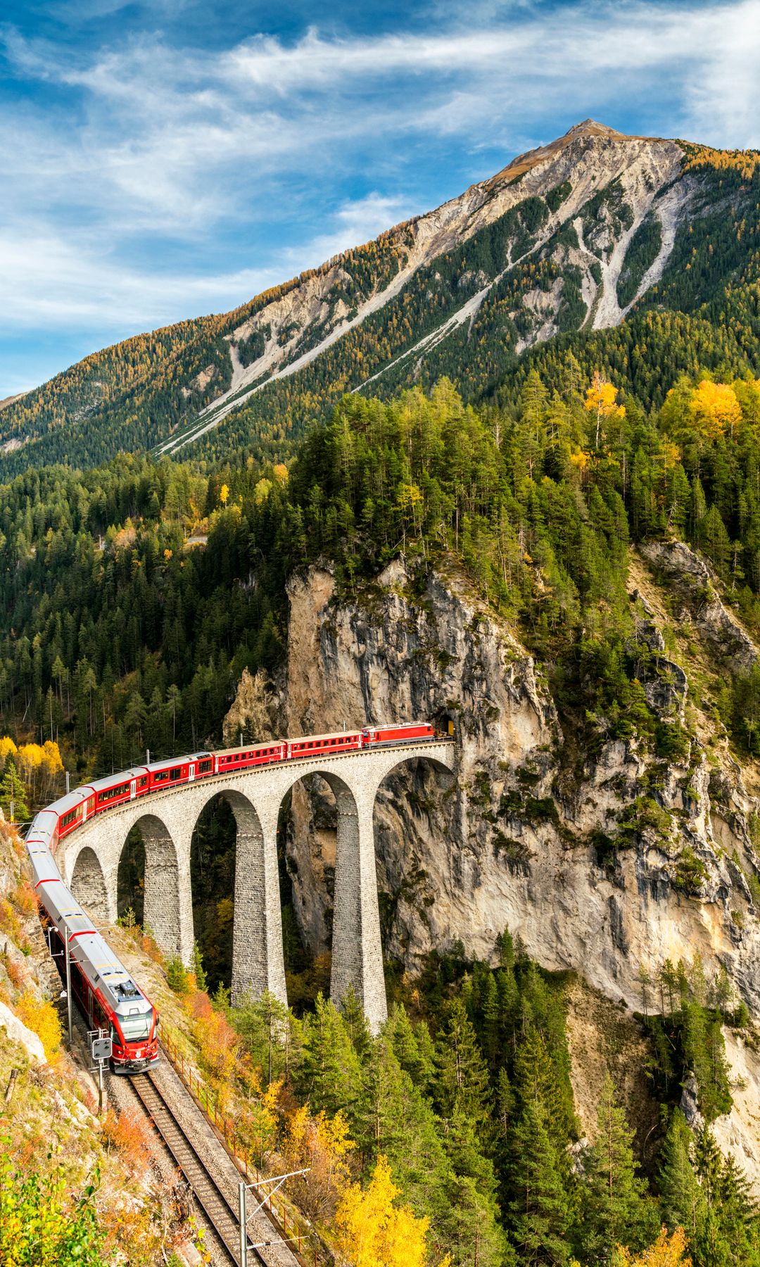 Bernina Express Train traveling on Landwasser Viaduct in autumn, Filisur, canton of Graubunden, Switzerland