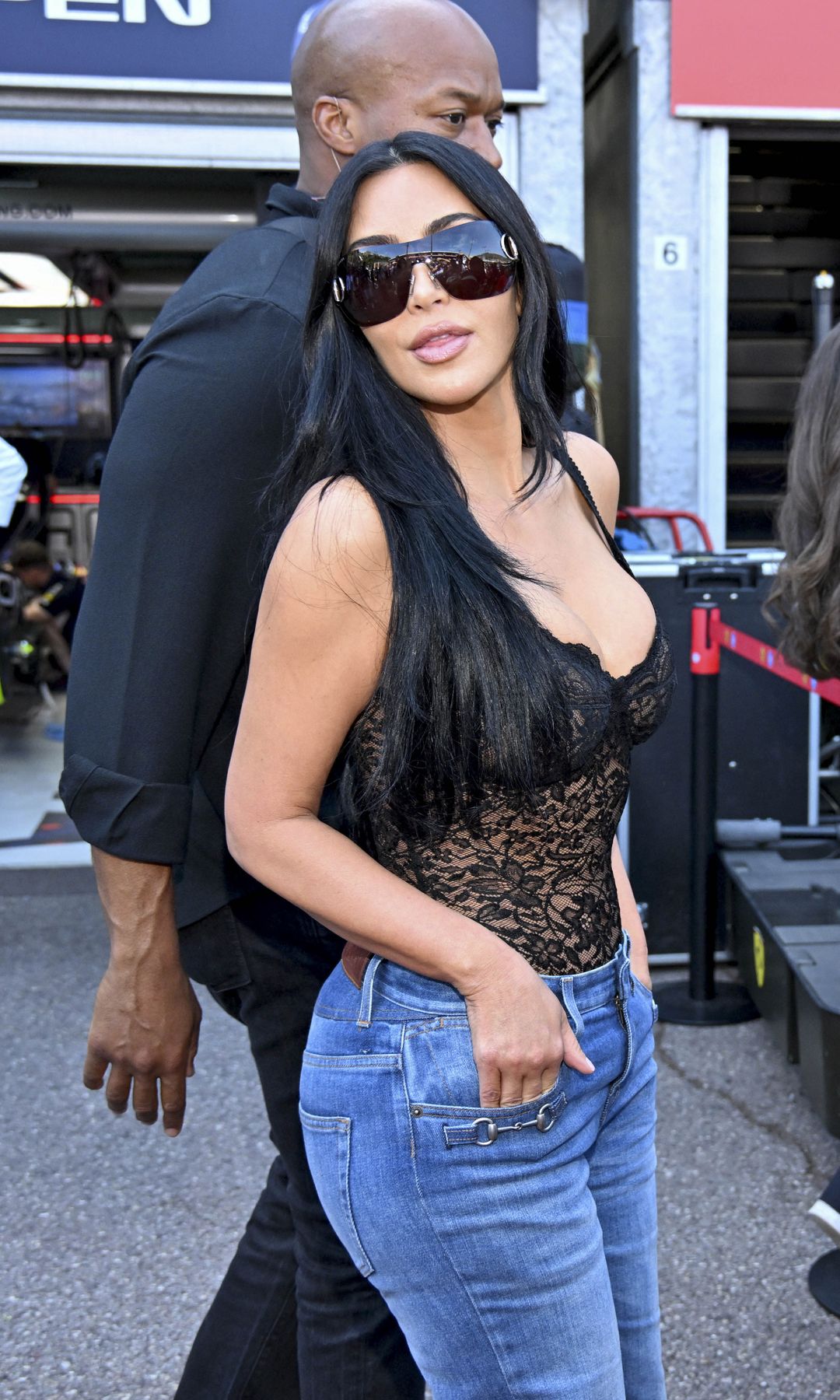 Kim Kardashian sparked debate among Formula 1 fans after stepping out in a sheer black lace top and oversized denim jeans during the Monaco Grand Prix weekend.