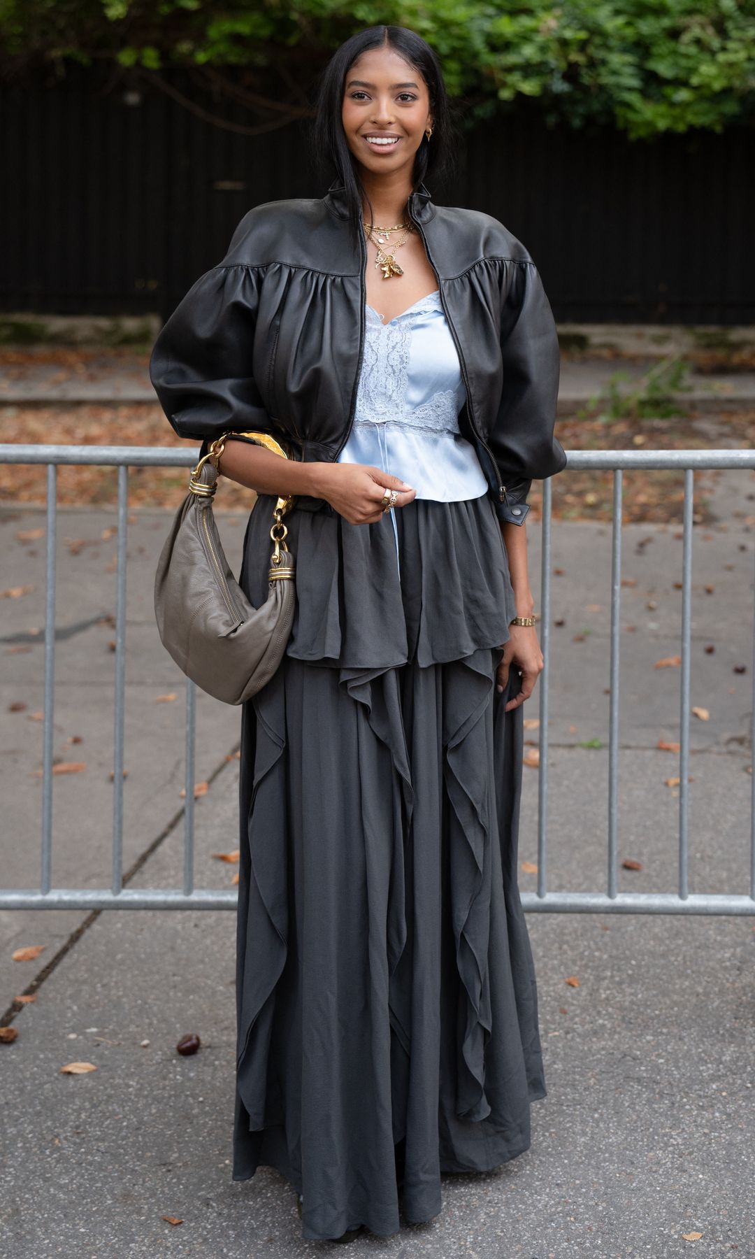 The layered jewelry sat against the pale blue satin and lace, giving the romantic top a more eclectic finish.