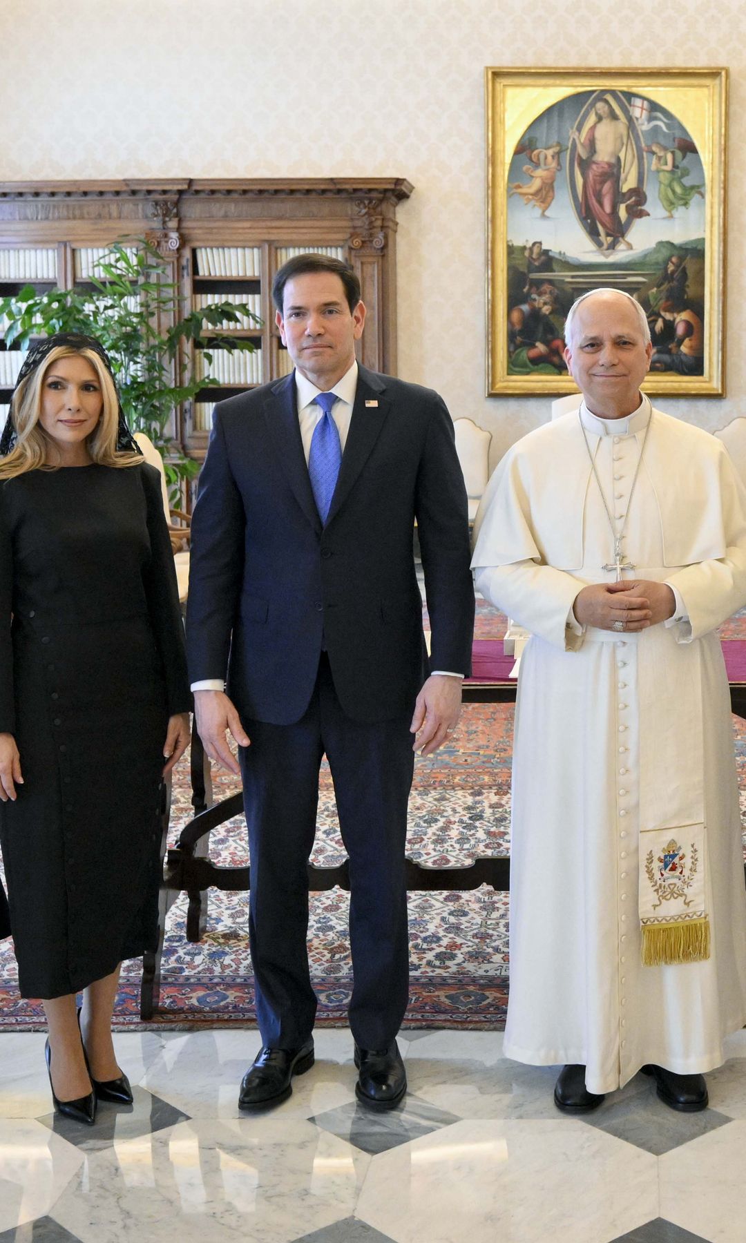 Pope Leo XIV poses with U.S. Secretary Of State Marco Rubio and his wife Jeanette Dousdebes Rubio during an audience at the Apostolic Palace