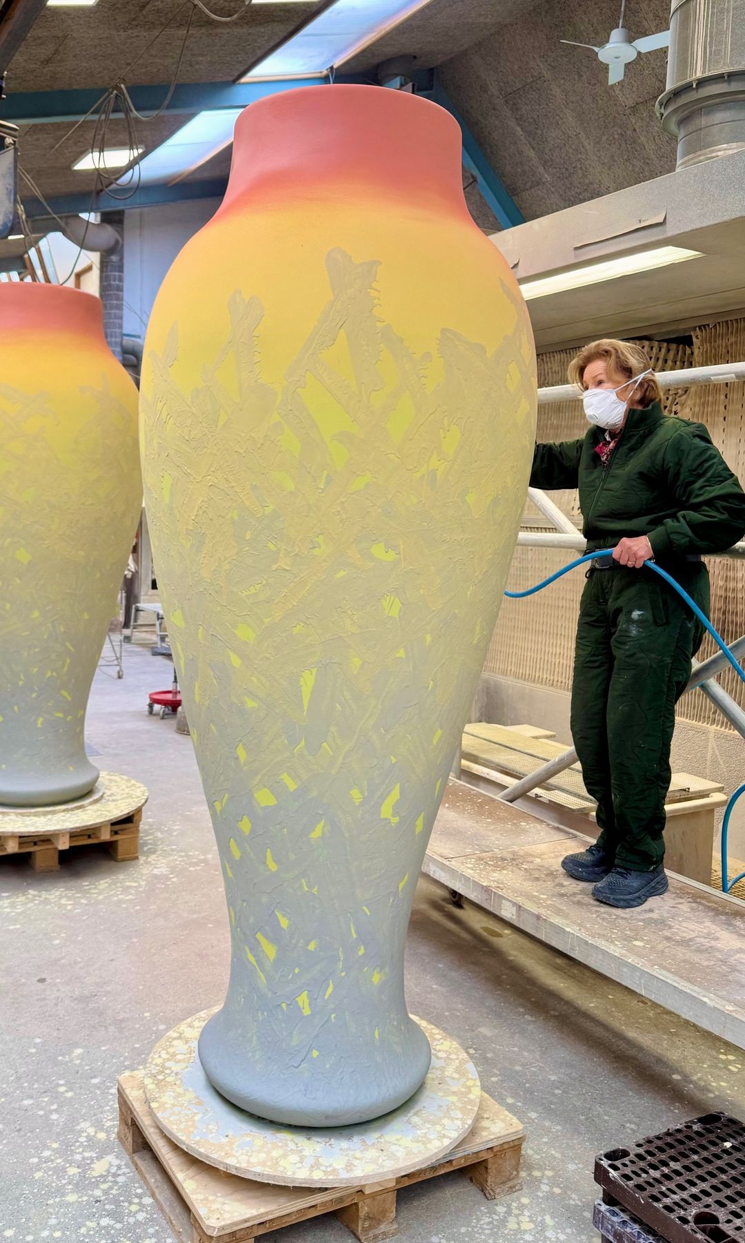 The Queen was featured on some impressive images showing her painting two enormous vases