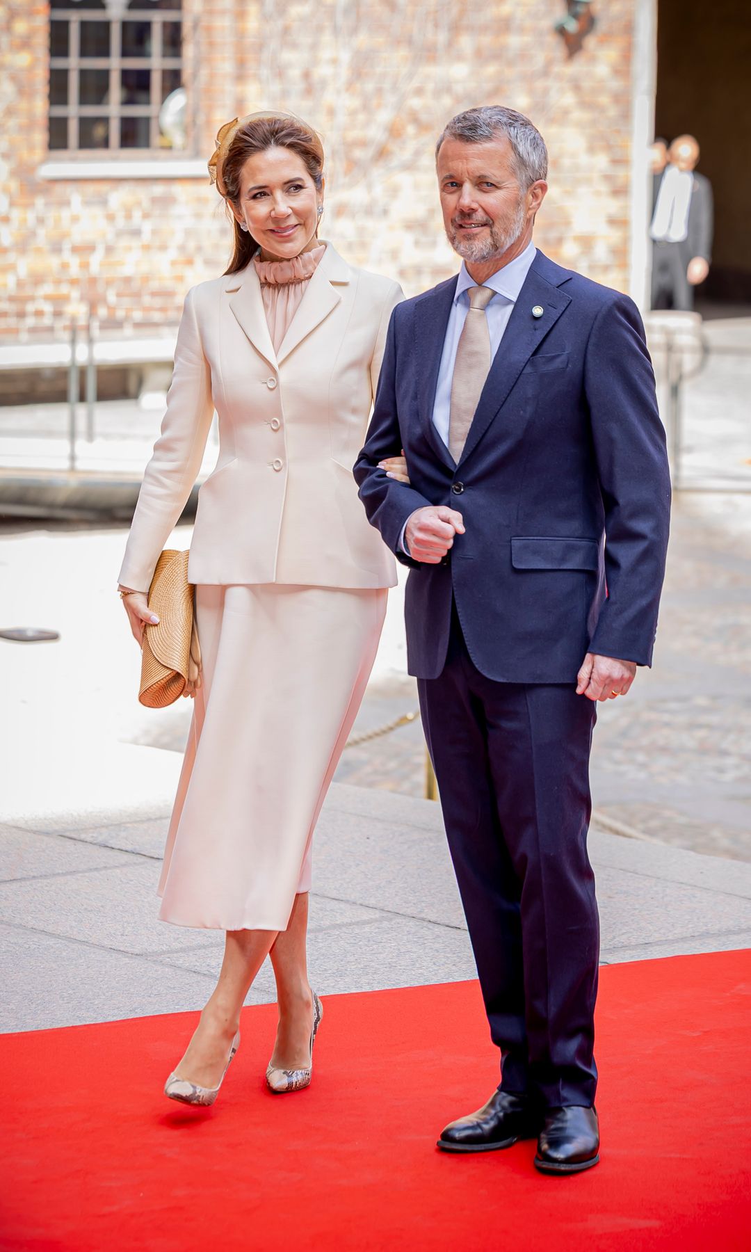 In the morning, Queen Mary opted for a Dior suit-dress