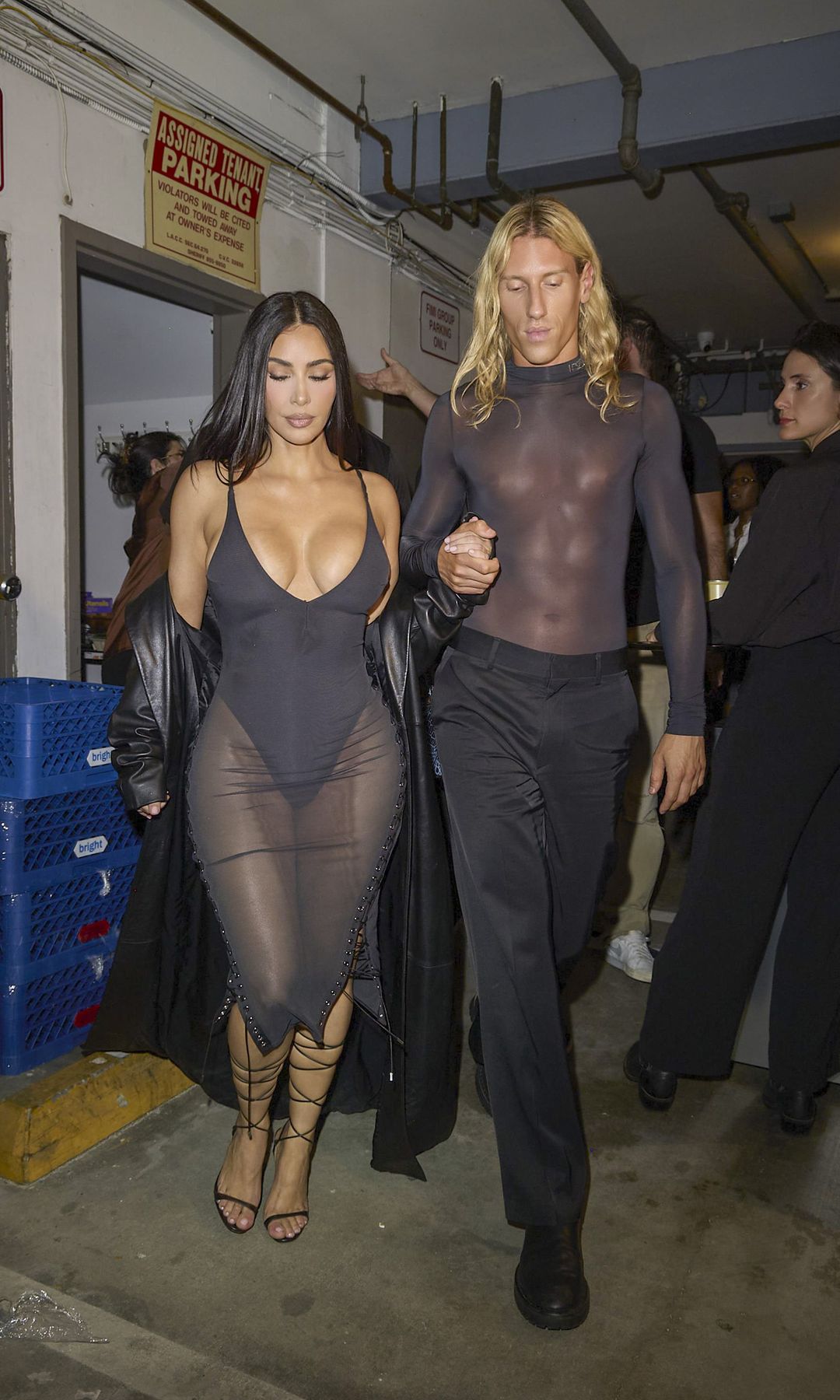 Kim Kardashian shocks while wearing deep cleavage and holding hands with Ludovic de Saint Sernin