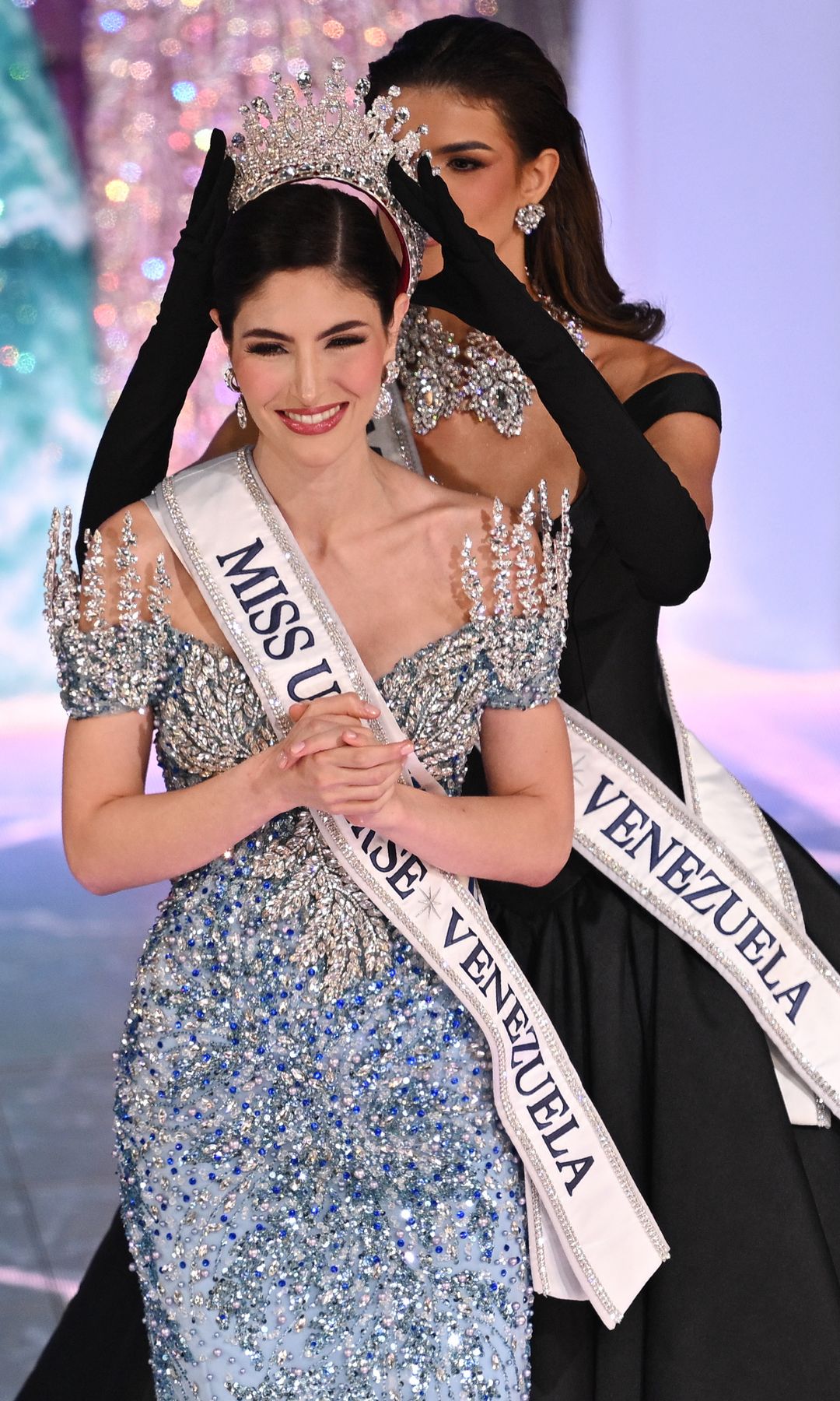 Miss Universe Venezuela 2024 Stephany Abasali (L) of Anzoategui State is crowned by outgoing Miss Venezuela 2023, Ileana Marquez, during the Miss Venezuela beauty pageant in Caracas.
