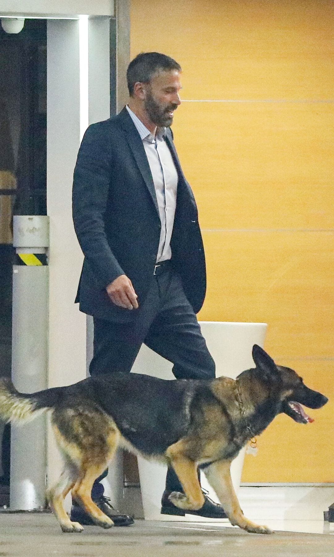 Ben was photographed in Los Angeles with his dog, a German Shepherd