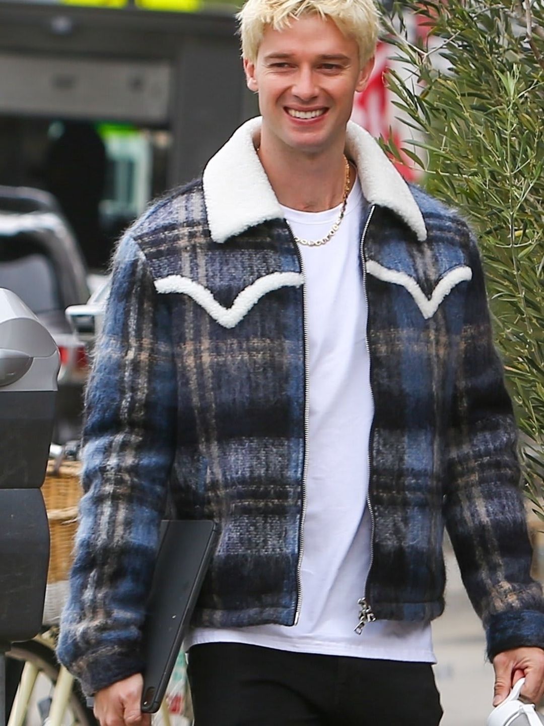 Patrick Schwarzenegger is seen smiling showcasing his new look as a blonde.