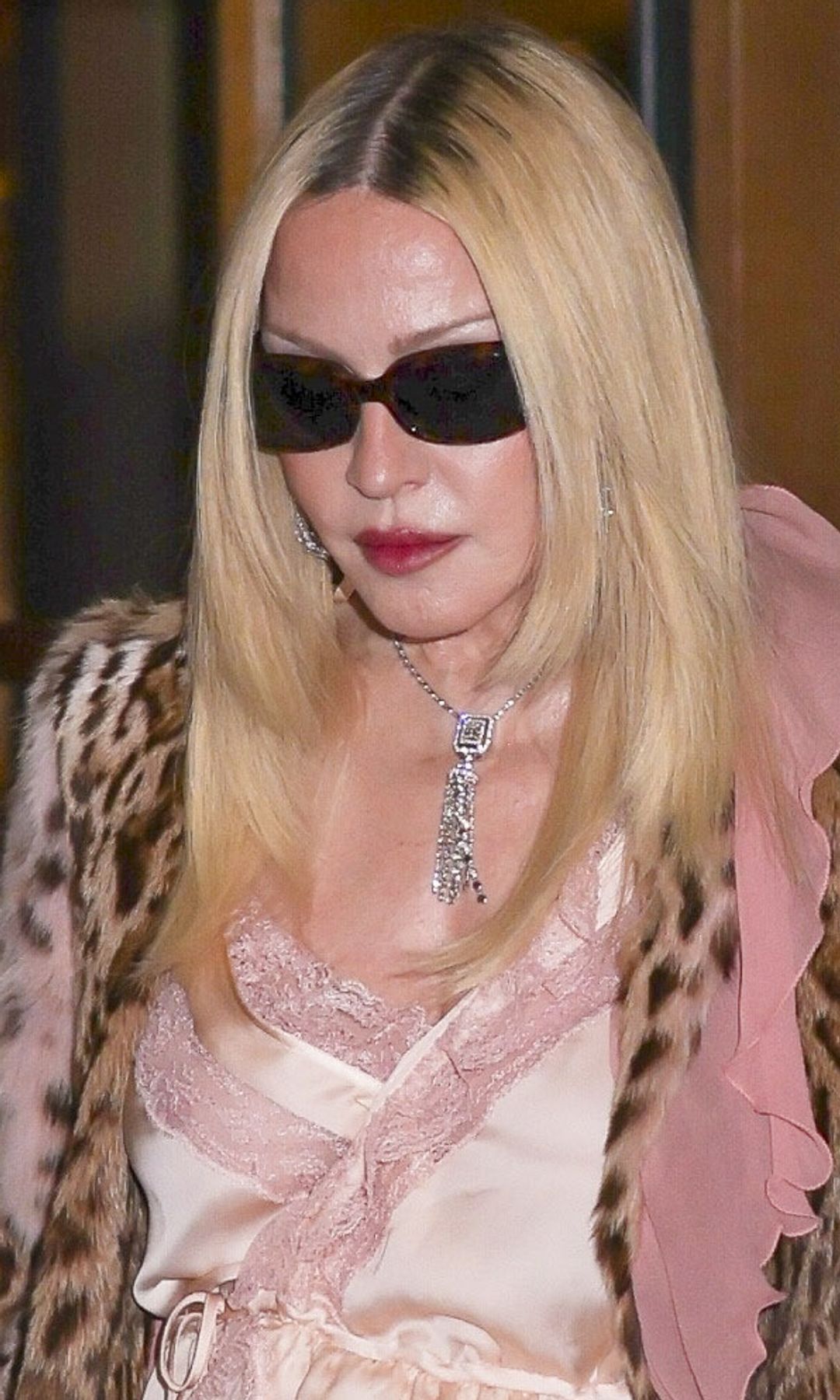Madonna turns heads in leopard print, lace, and towering boots at Paris Fashion Week