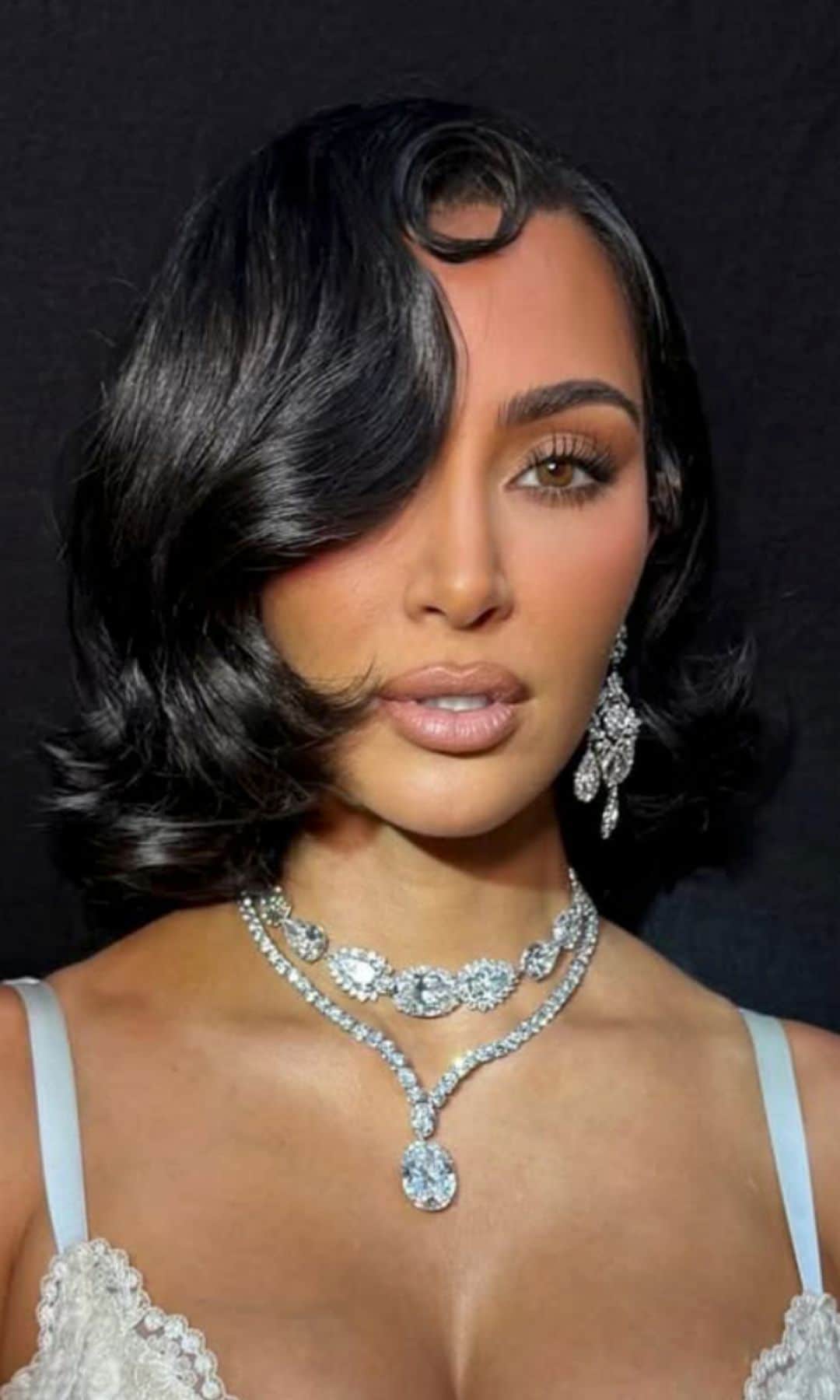 Kim Kardashian poses in Elizabeth Taylor's iconic diamond earrings: 'She understood her power and her beauty'