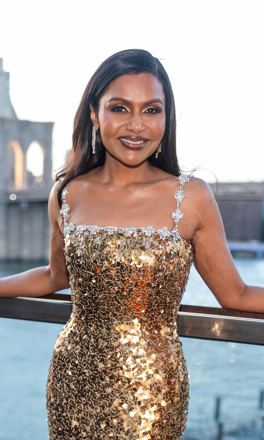 Mindy Kaling looks ravishing in a gold gown and slimmed-down figure