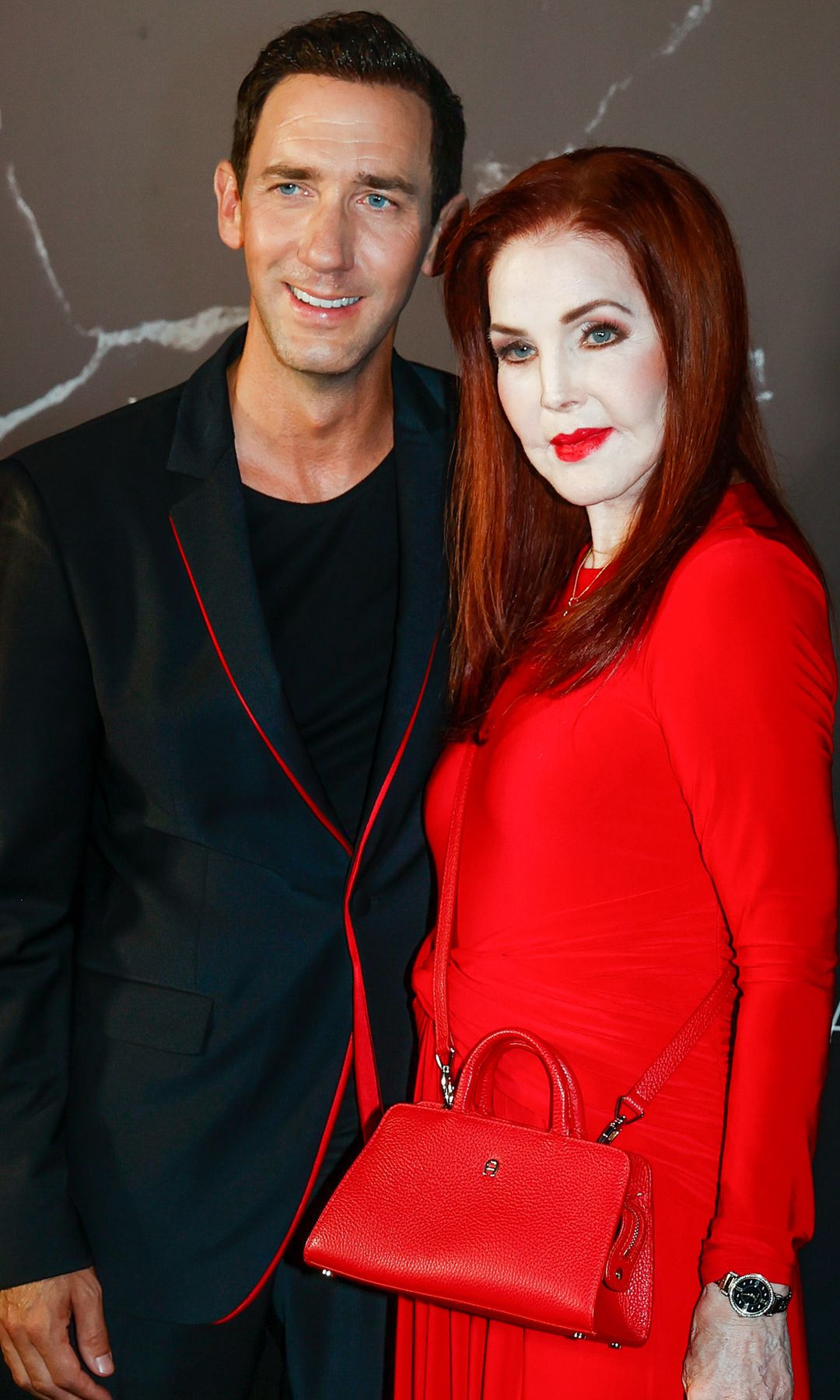 Priscilla Presley turns heads in vibrant red gown during rare appearance at glamorous Mallorca event