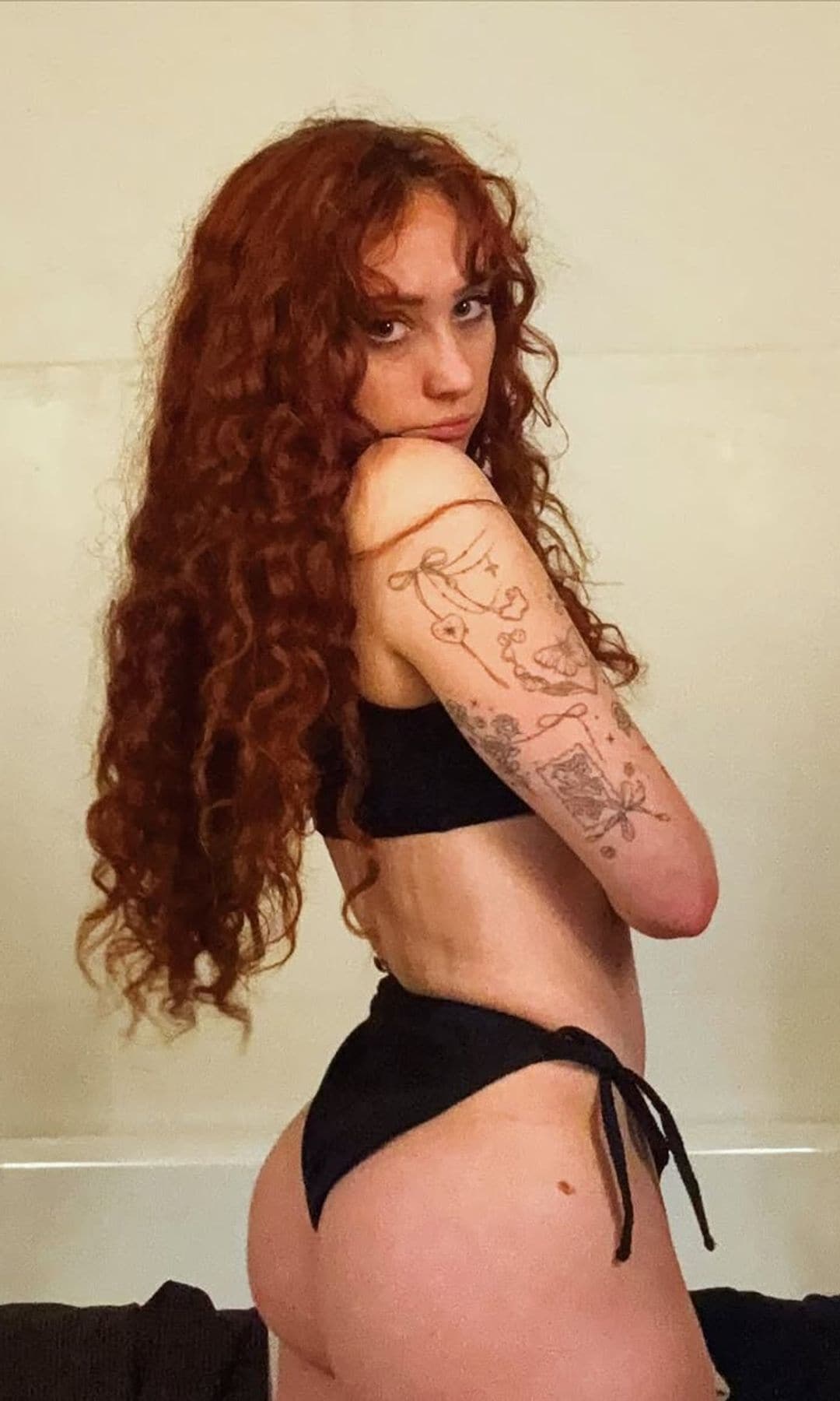 Chappell Roan in a black bikini - no makeup