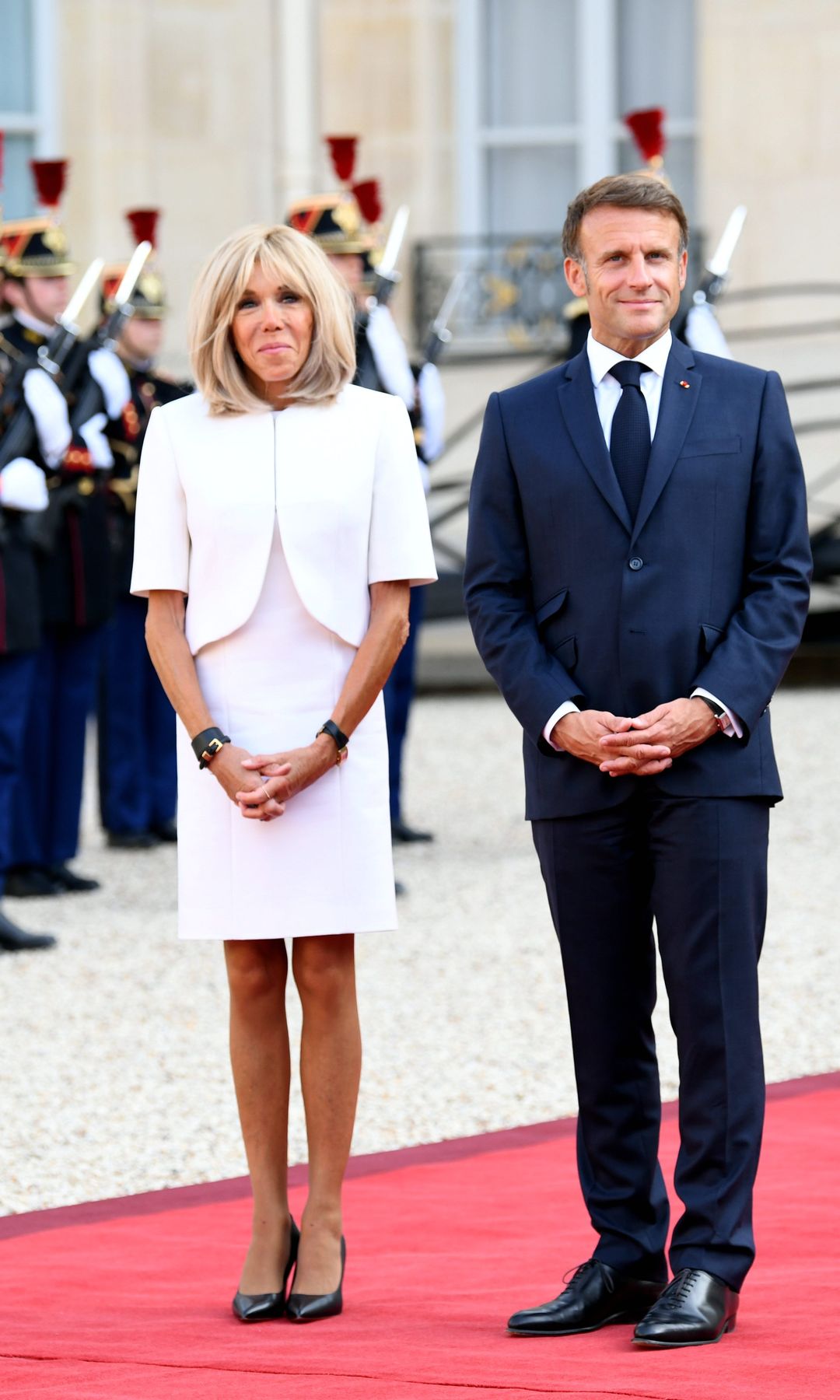 French President Emmanuel Macron and his wife Brigitte Macron wait to welcome guests during a welcome ceremony for international dignitaries and guests attending the opening ceremony of Paris 2024 Paralympic Games at Elysee Palace on August 28, 2024 in Paris, France. (Photo by Li Yang/China News Service/VCG via Getty Images)