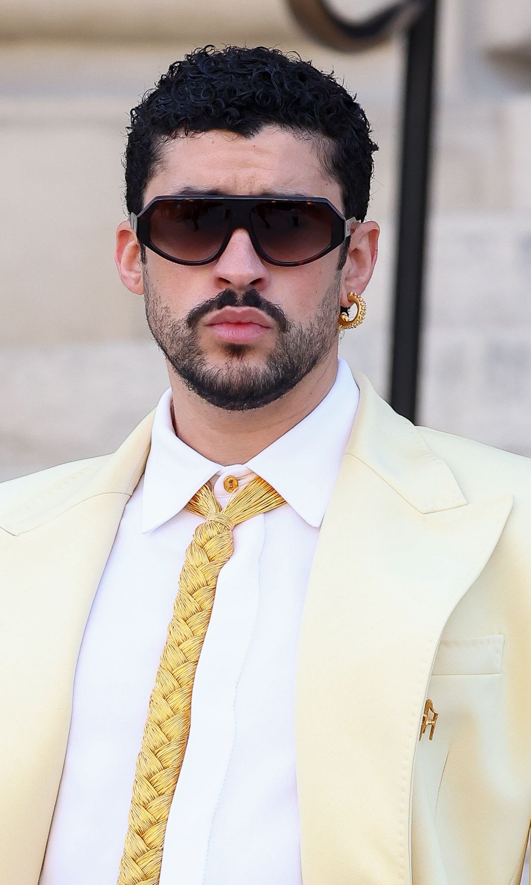 Bad Bunny wears heels while reviving the butter yellow trend at Paris Fashion Week [PHOTOS]