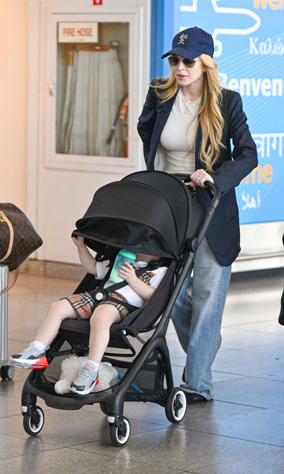 Lindsay Lohan nails mom-chic style while touching down in New York with her family