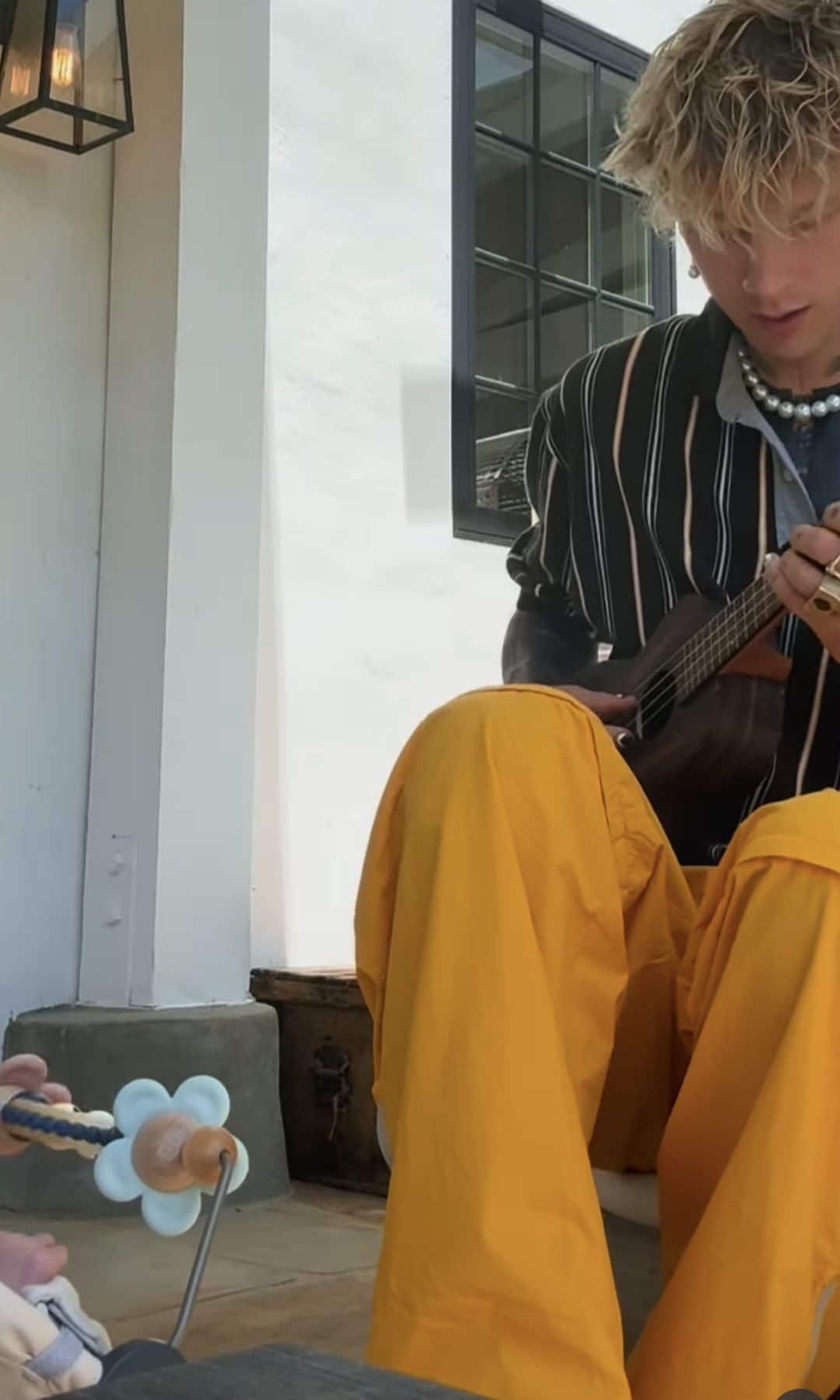 Kelly shared a video of himself and his baby enjoying some music