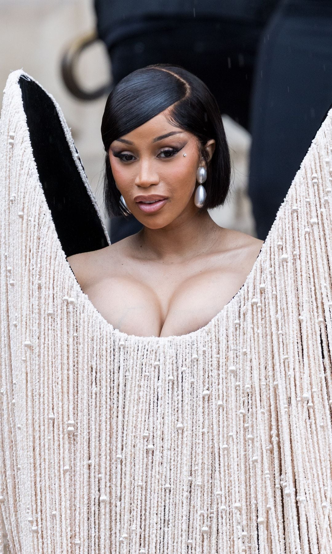 Cardi B stole the show in Paris with two looks, including Kim Kardashian-inspired minidress
