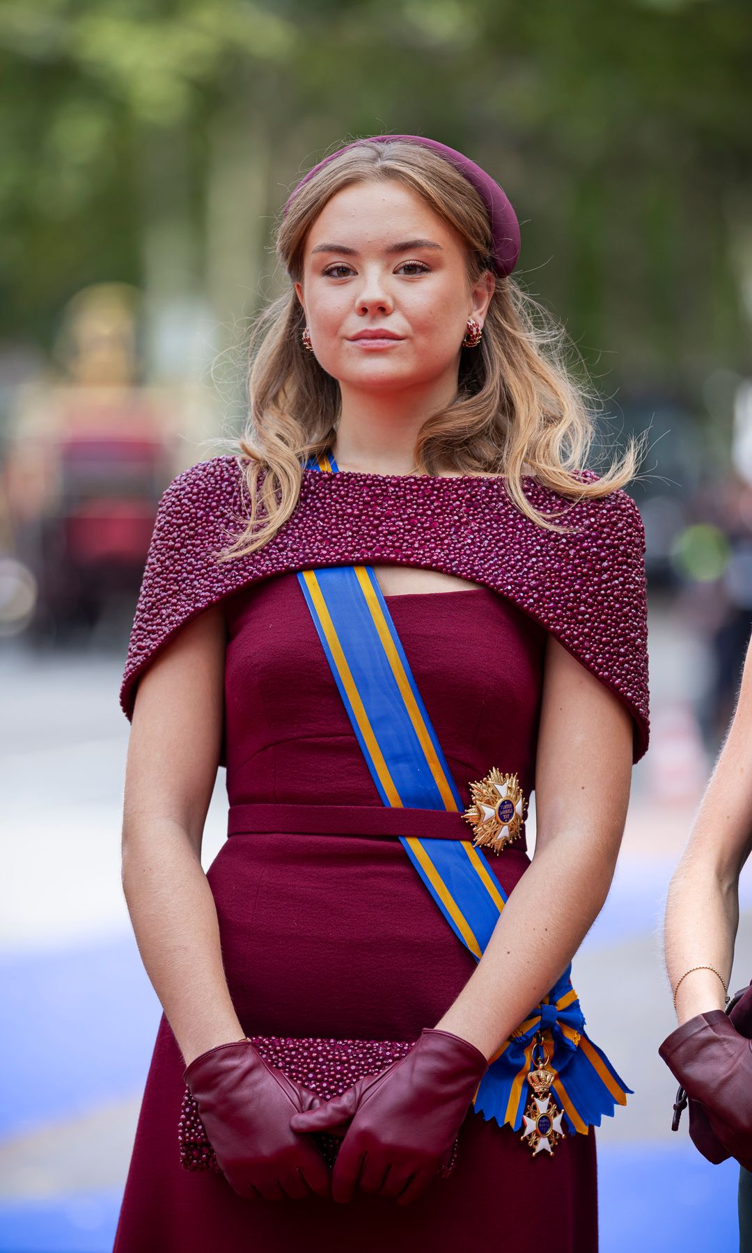 Princess Alexia of The Netherlands opted for burgundy, with a dress her mother first wore seven years ago.