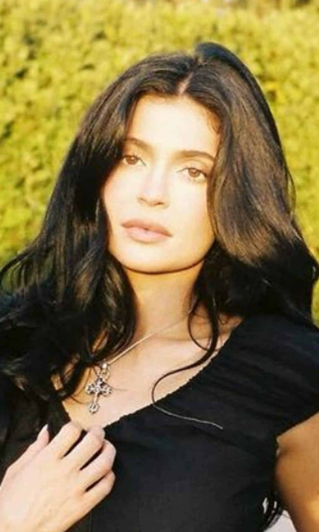 Kylie Jenner poses in see-through lace and low-rise jeans in intimate fall look