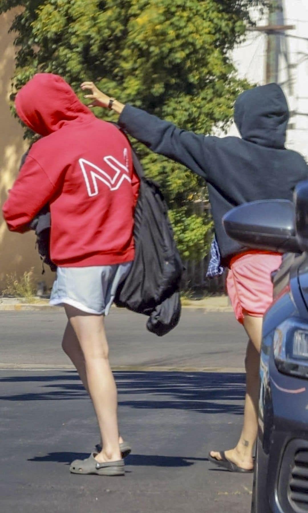 Keoni playfully shoved Shiloh as they left their car