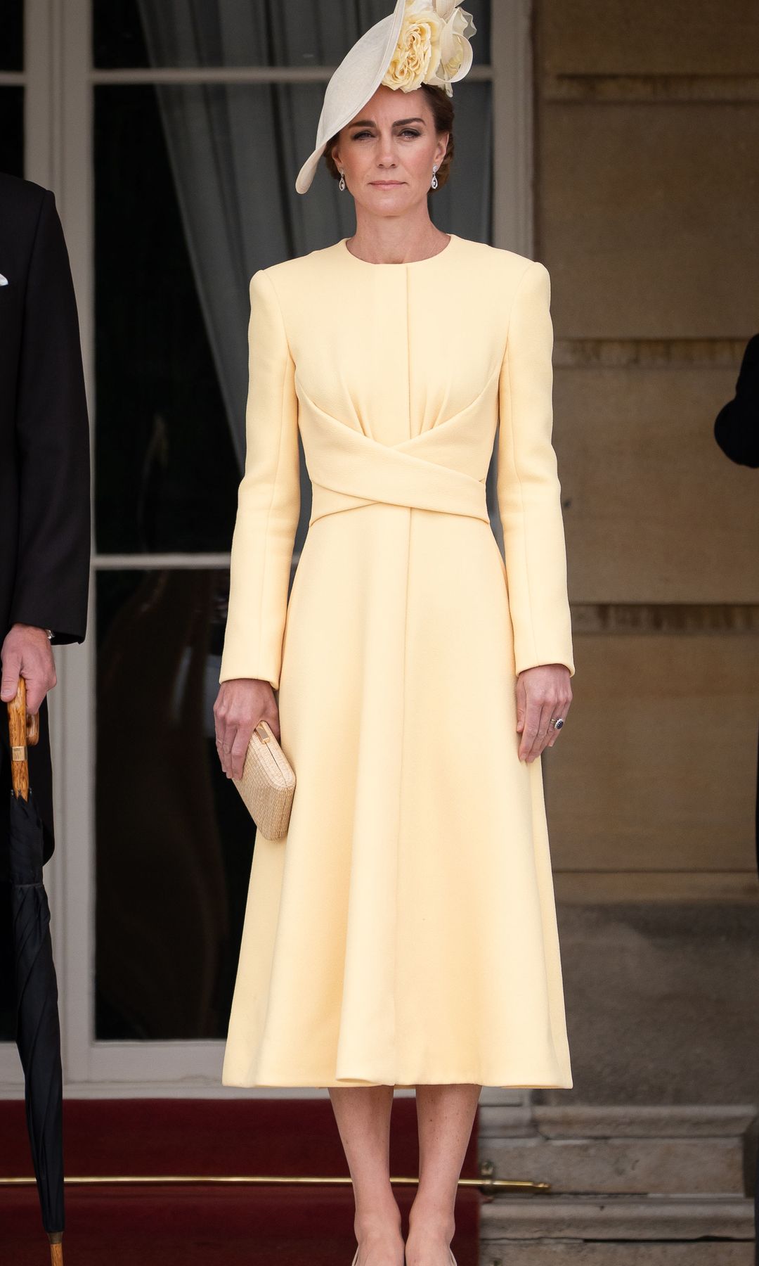 LONDON, ENGLAND - MAY 20: Catherine, Princess of Wales stands at the top of the Garden steps, as the National Anthem is played, before the start of a Royal Garden Party at Buckingham Palace on May 20, 2025 in London, England. (Photo by Aaron Chown - WPA Pool / Getty Images)