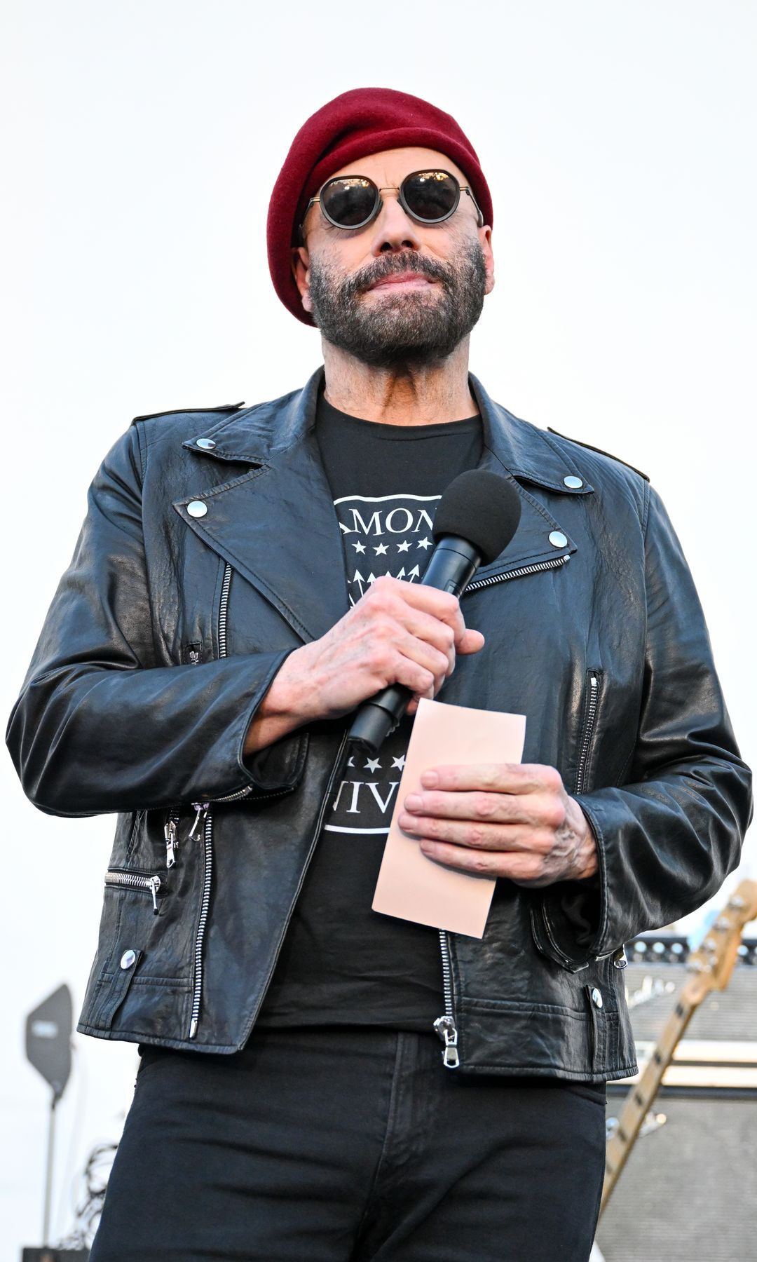 John Travolta at The Official Ramones 50th Anniversary Tribute held at Hollywood Forever Cemetery on August 30, 2026 in Los Angeles, California.