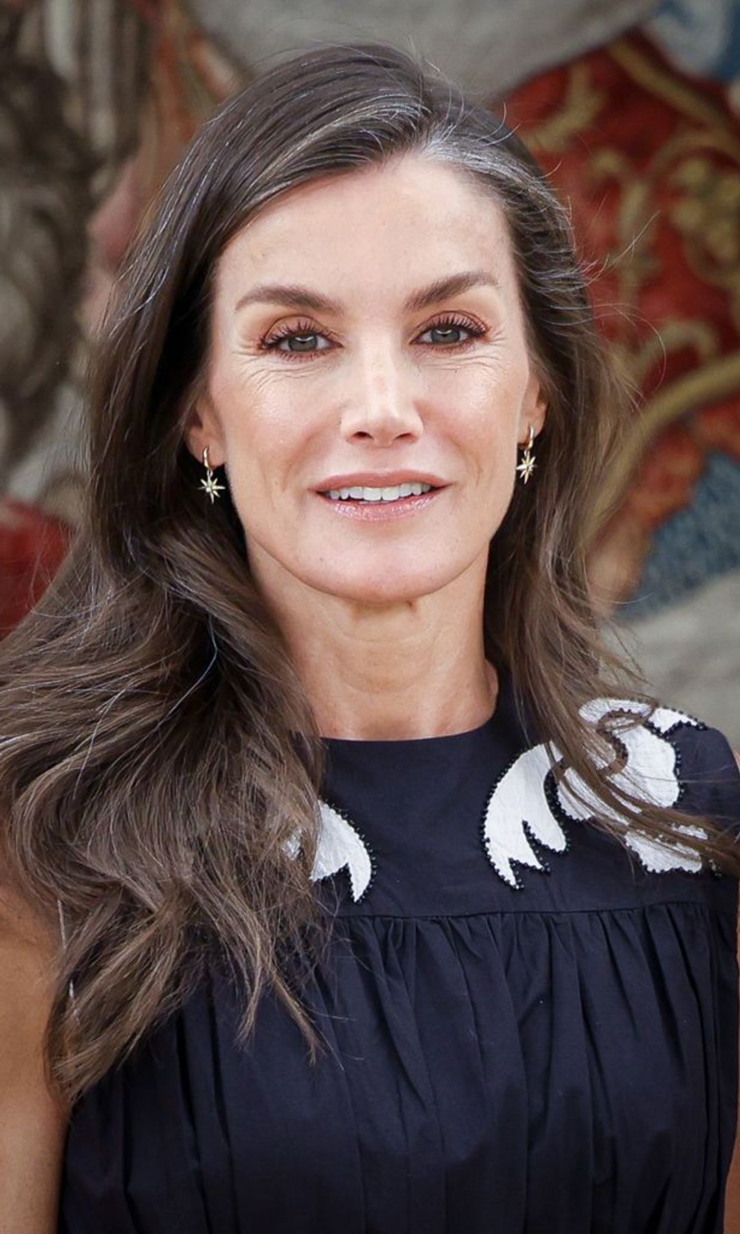 Her earrings represent the two world cups won by the Spanish team