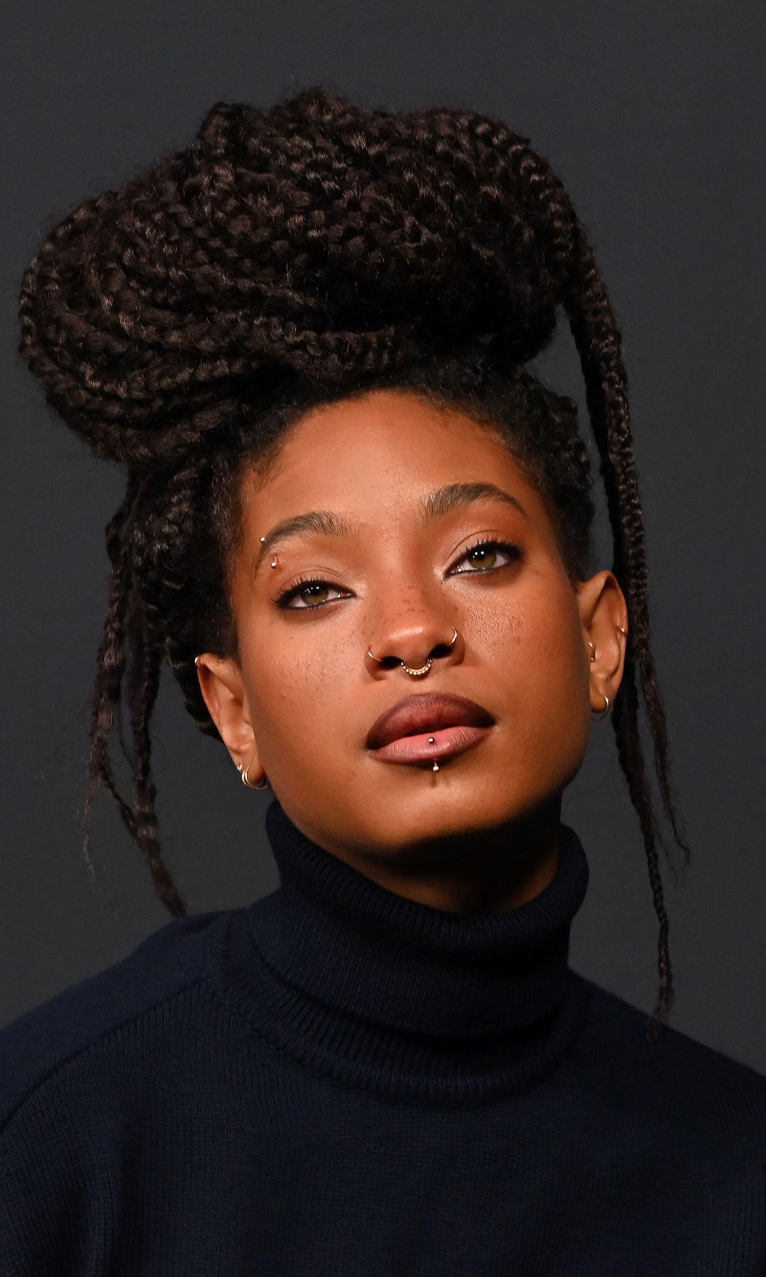 Willow Smith turns heads in emerald green dress and purple thigh-highs for major music announcement