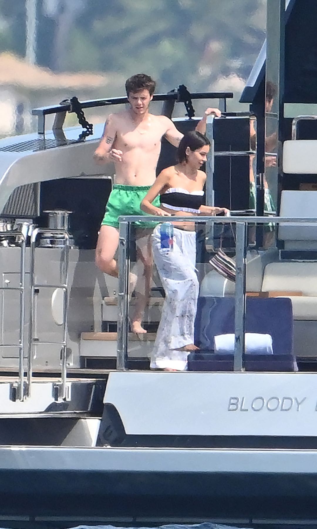 Cruz opted for green swim trunks while Jackie wore a black and white bikini bathing suit