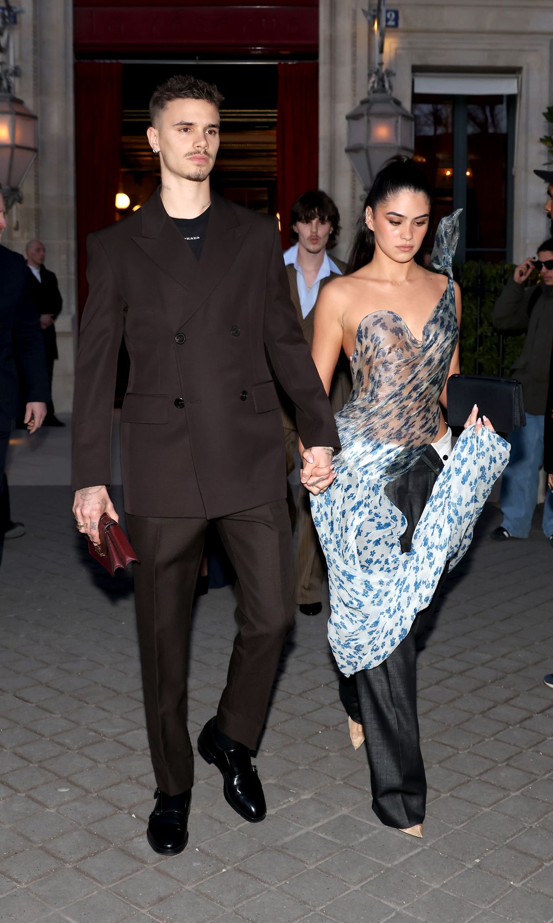 Romeo Beckham and Kim Turnbull at Paris Fashion Week in March 2025