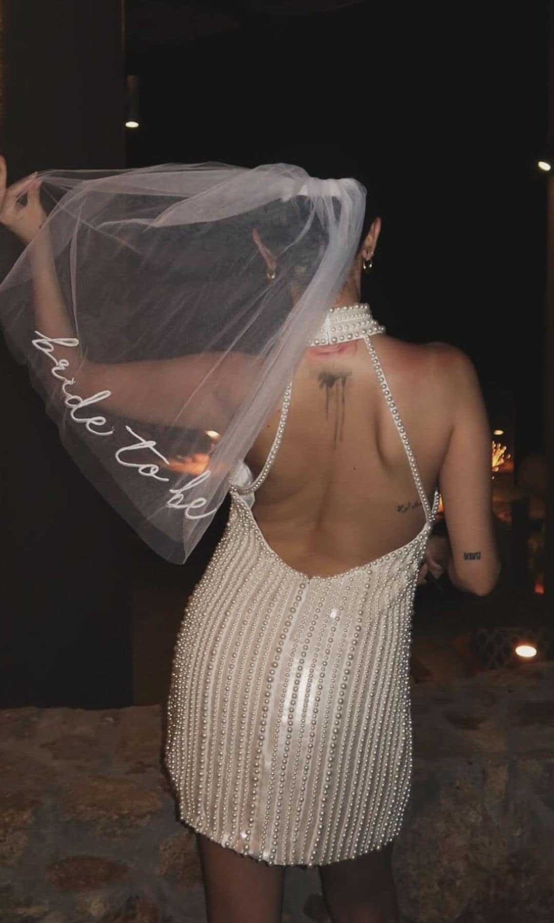 Gomez also wore a stunning white dress with a veil that read 'bride to be'
